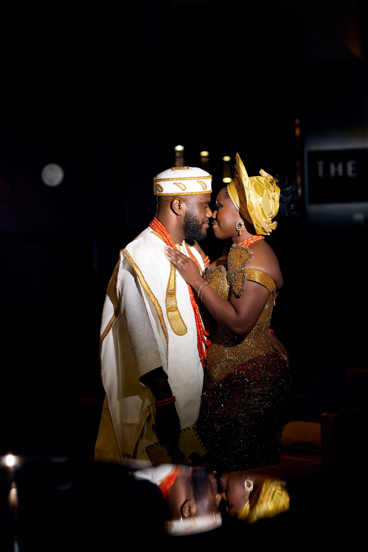 Arinze and Mary in traditional dress, foreheads touching